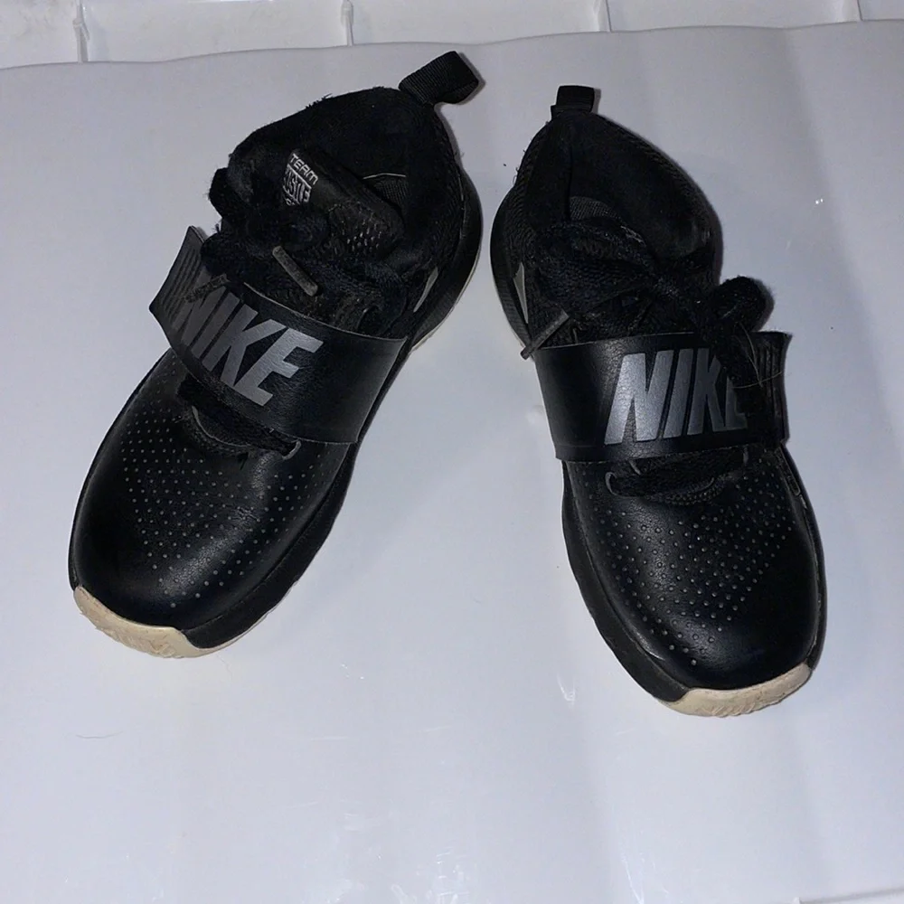 Nike team hustle, size 13, black with silver shoes